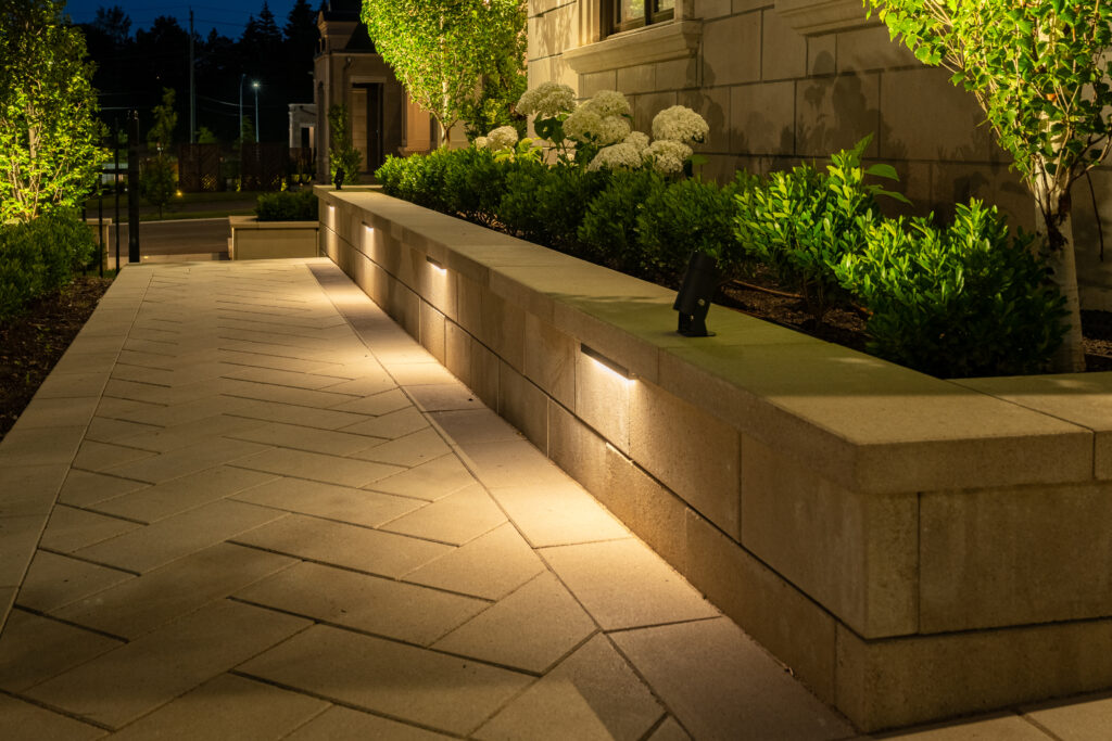 Lightio 12V outdoor LED landscape lighting on a stone walkway